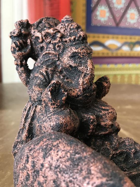 Hand with Ganesha incense holder